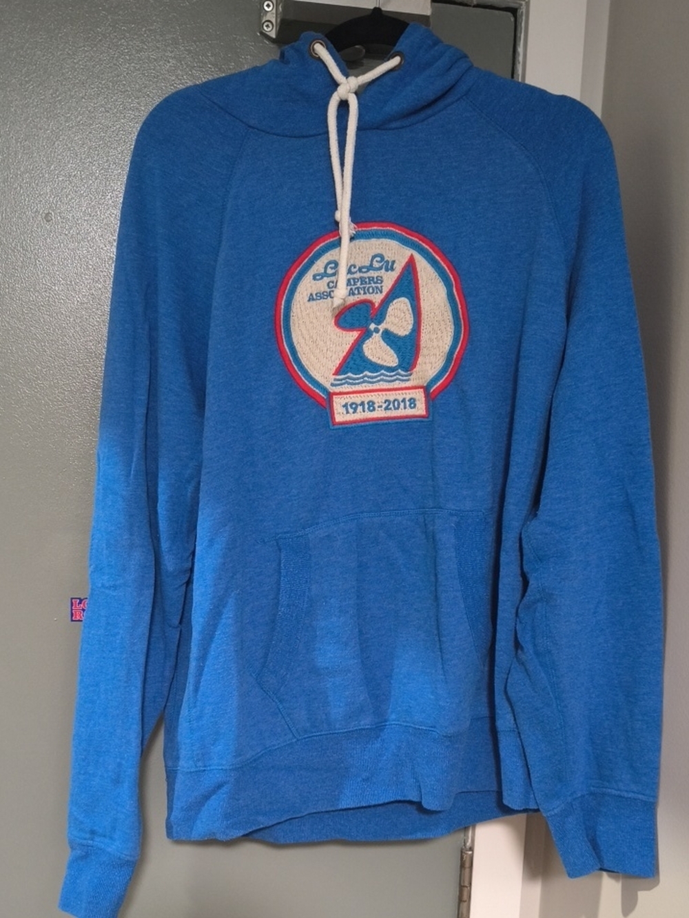 Men's Blue Hooded Pullover with Nautical Crest Graphic